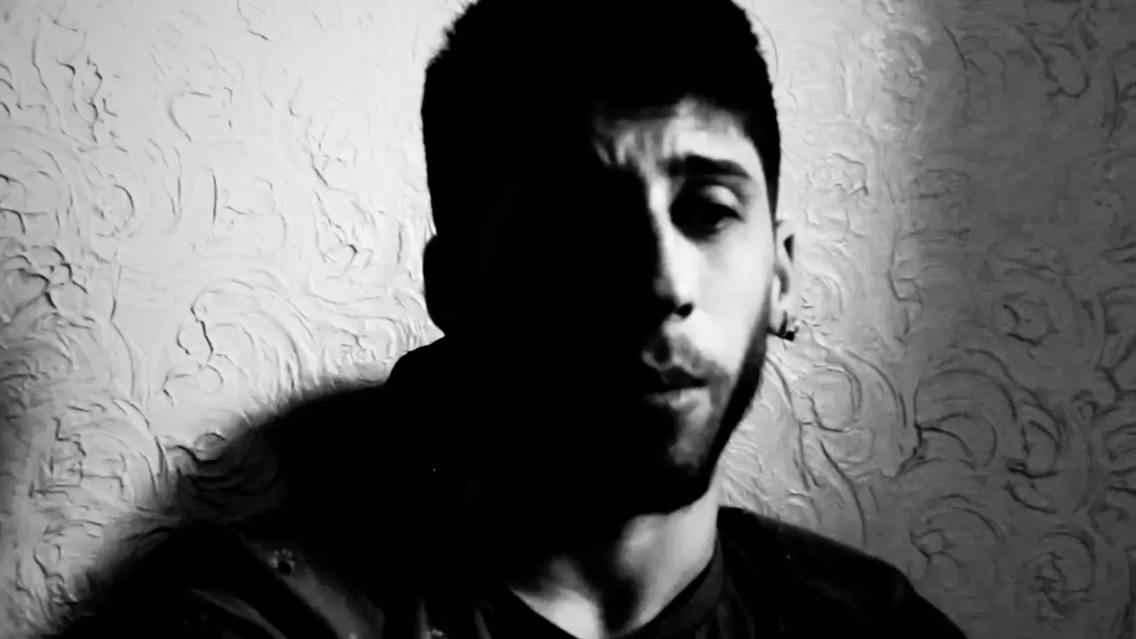 Black-and-white portrait from BLOOD TAPE